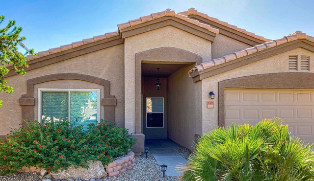Spacious desert home with hot tub, covered patio, grill, & modern finishes