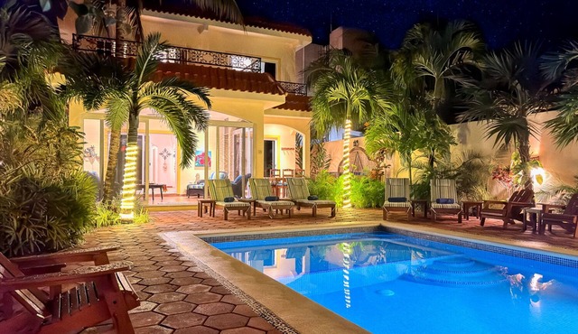 Spacious Hacienda style home with charming garden, screened porch and pool