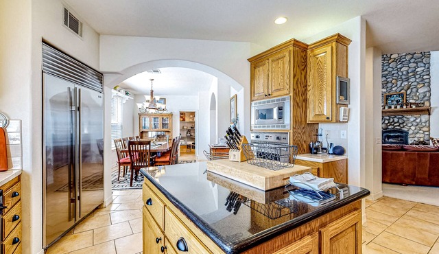 Spacious home on 3.5 acres with covered patio, gourmet kitchen, & patio
