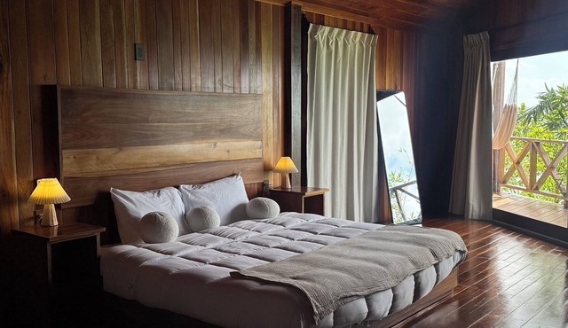 Suite with lagoon view, balcony and private pier