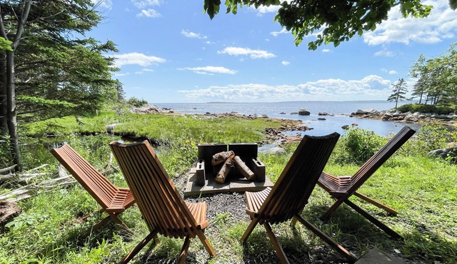 The oceanside Hideaway is nestled between the trees with stunning ocean views