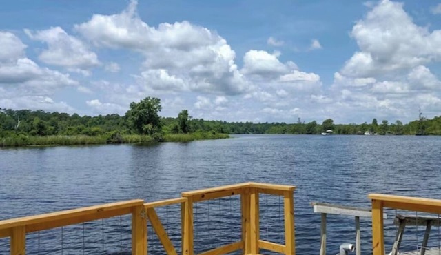 This beautiful 3-bedroom 2-bathroom Riverfront home is a great place to unwind. in Georgetown