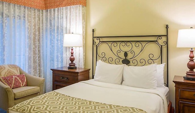 UpScale Resort with Outdoor Heated Pool with a waterslide and a poolside bar, tennis court and gym