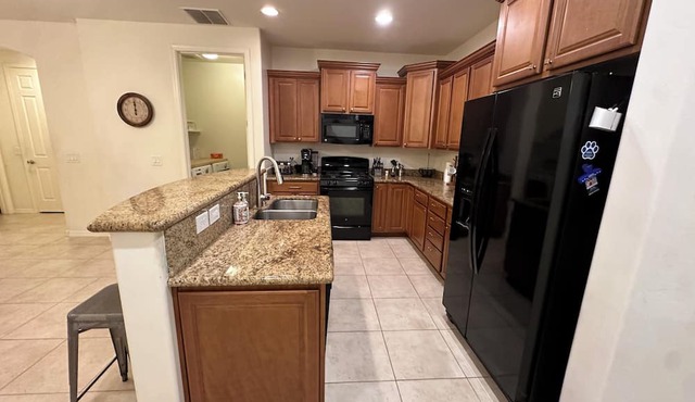 Peaceful, 4-bedroom oasis with fruit trees and sparkling pool.